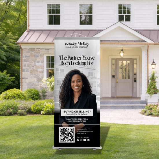 A Bentley McKay real estate advertisement is displayed in front of a house, promoting the idea of finding the right place to buy or sell a home.